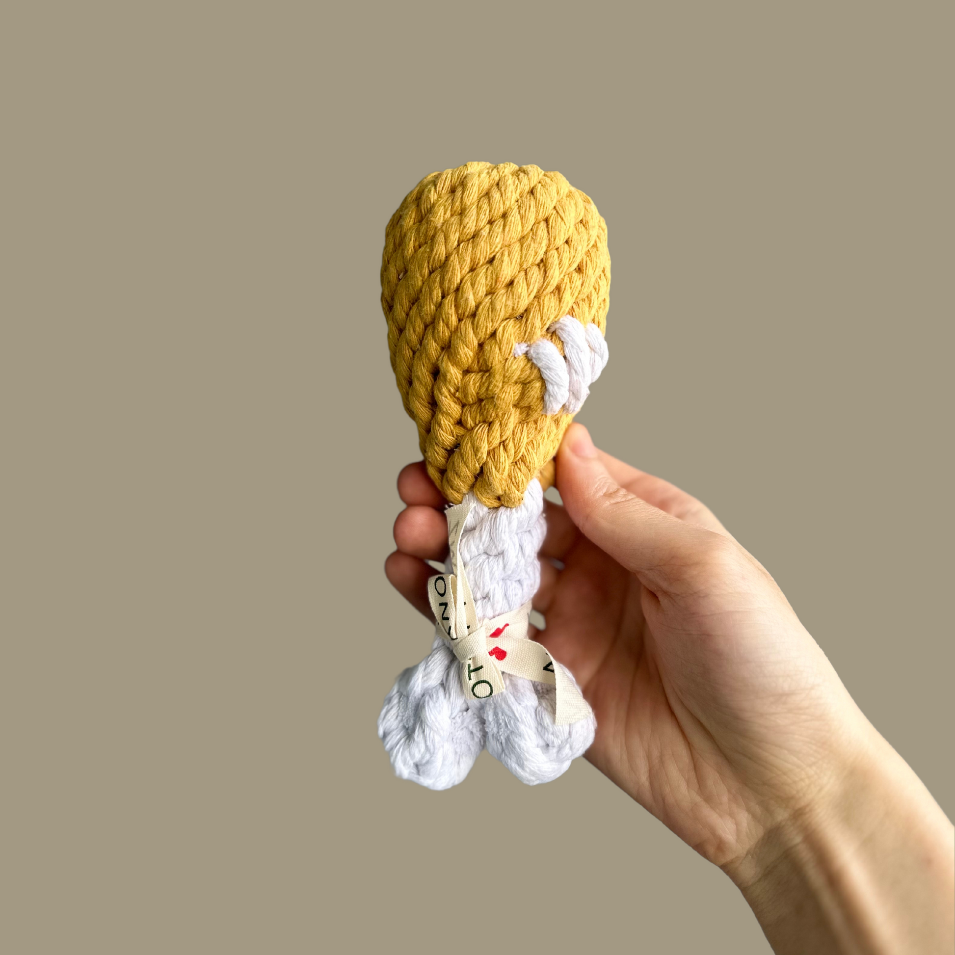 Chicken Leg Tug Cotton Rope Toy - A durable dog toy shaped like a chicken leg, made from strong cotton rope. Ideal for tugging, chewing, and interactive play, this toy provides fun and exercise for your pet.