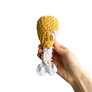 Drumstick Delight Cotton Rope Pet Toy - A dog toy shaped like a drumstick, made from durable cotton rope. Perfect for chewing, tugging, and interactive play, this toy offers fun and stimulation for your pet.