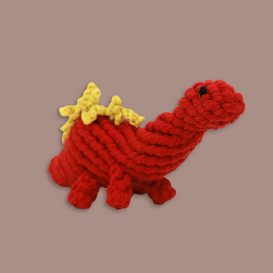 Red dinosaur-shaped pet toy handwoven with cotton rope, providing fun and comfort.