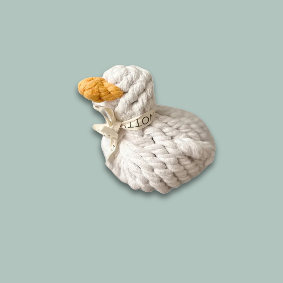 Side view of a white duck pet toy, intricately woven from durable cotton rope, designed for pets to play and chew.