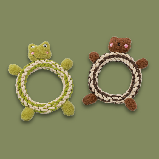 Front view of donut-shaped frog and bear-shaped pet toys made of woven cotton rope. The frog toy has a green body with big eyes, and the bear toy has a brown body with a friendly face. These toys are perfect for pets to play with and chew on, combining cuteness and durability for your pet's enjoyment.