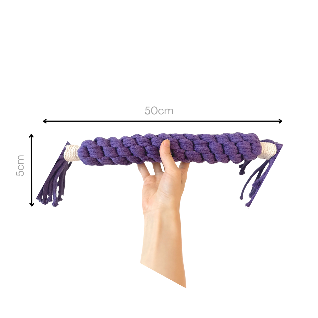 A purple large candy-shaped pet toy woven with cotton rope. It is soft, colorful, and designed to keep your pet entertained and engaged. Ideal for play and interaction.